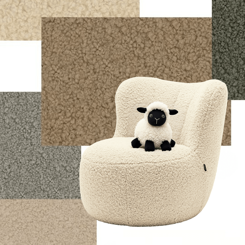 Polstersessel mit unterschiedlichen Farben im HIntergrund und Kuscheltierschaf auf dem Sessel