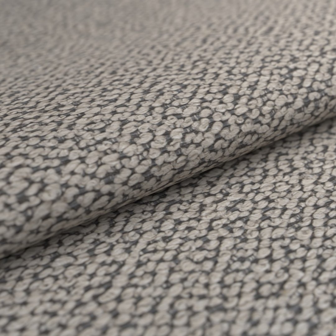 Nahaufnahme von Stoff mit strukturierter Oberfläche in Beige und Grau