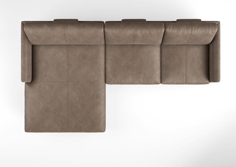 Vogelperspektive eines L-förmigen Ecksofas aus braunem Leder mit drei Sitzmöglichkeiten und einer Chaiselongue