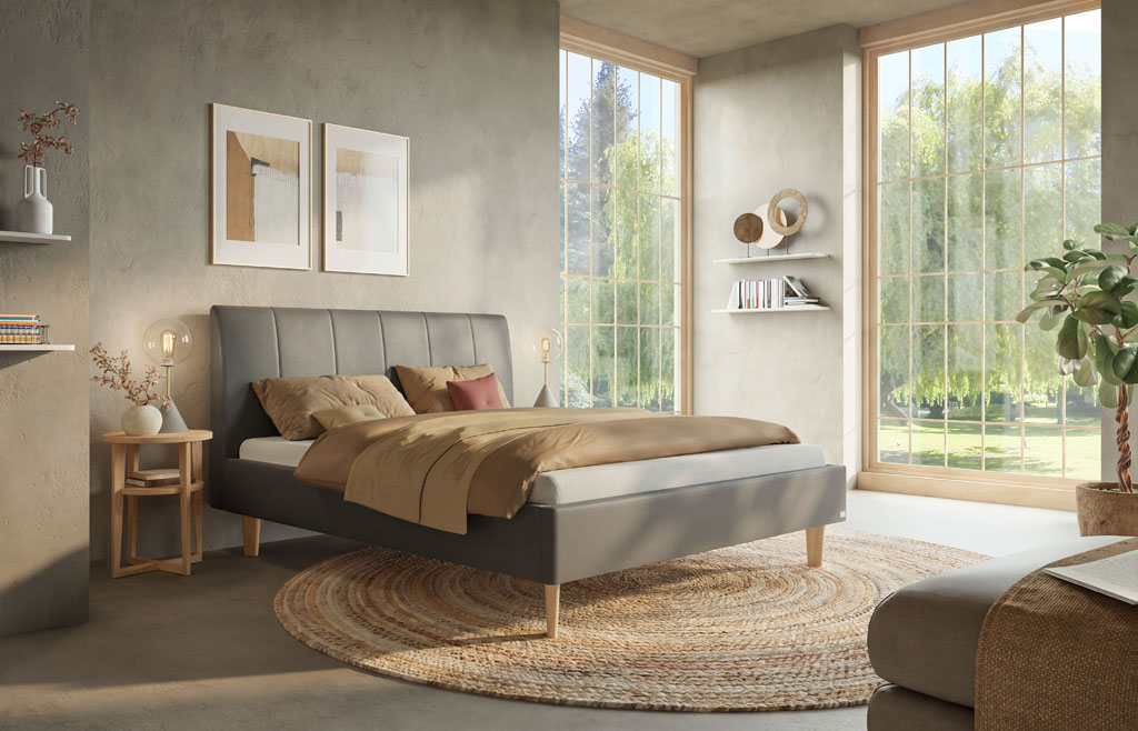 Modern eingerichtetes Schlafzimmer mit dunkelgrauem Polsterbett, vertikal abgestepptem Kopfteil, Holzfüßen und großem runden Teppich (KI-generiert)