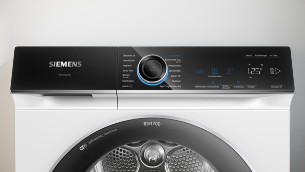 Nahaufnahme einer Siemens Waschmaschine mit digitalem Display und verschiedenen Einstellungen