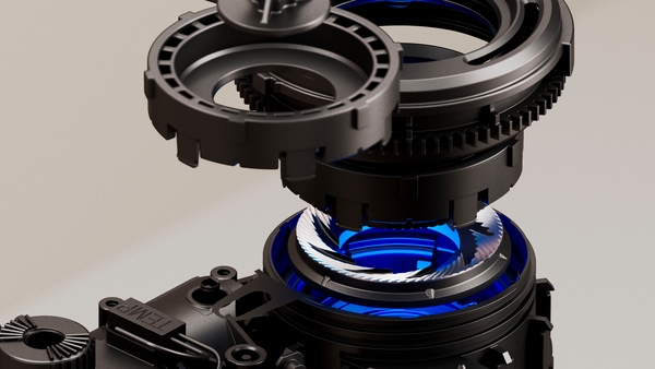 Nahaufnahme einer mechanischen Baugruppe mit verschiedenen Zahnrädern und blauen Akzenten