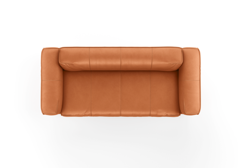 Vogelperspektive auf ein camelbraunes Ledersofa, elegante und moderne Gestaltung.
