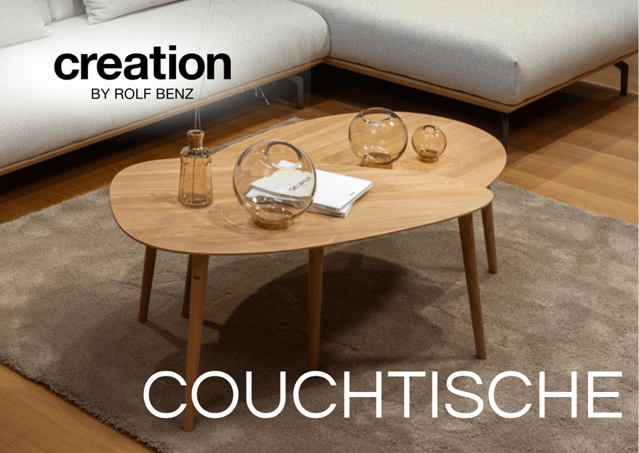 Zwei Holz Couchtische in organischer Form. Aufschrift "Couchtische"