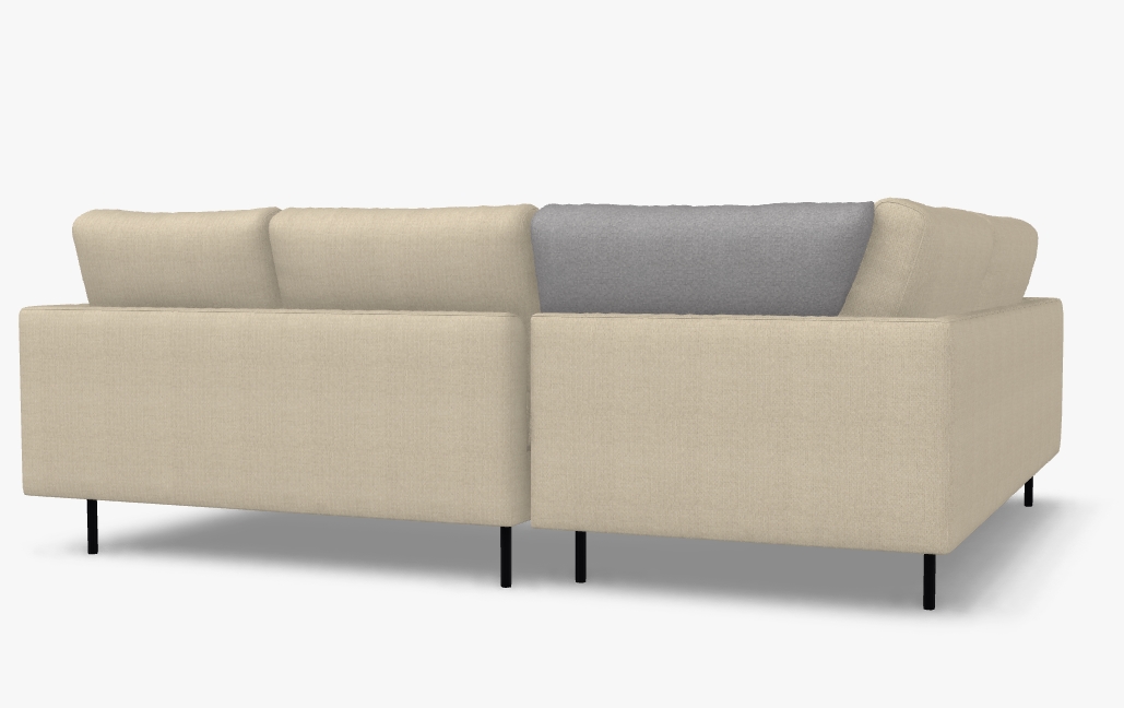 beiges sofa mit schwarzen füssen und rückenkissen mit rollen von rückseite gezeigt ein kissen zur ansicht in grau vor weißem hintergrund freistil rolf benz 134