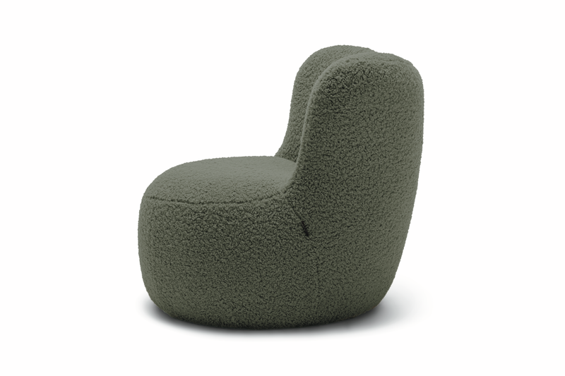 dunkelgrüner designersessel im plüschbezug vor weißem hintergrund freistil rolf benz 173