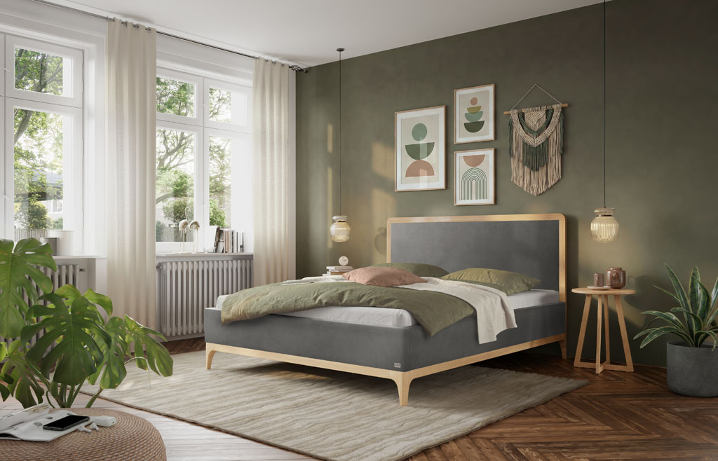 Gemütliches Schlafzimmer mit dunkelgrauem Polsterbett, Holzrahmen aus heller Eiche, Wanddekoration und Pflanzen (KI-generiert)