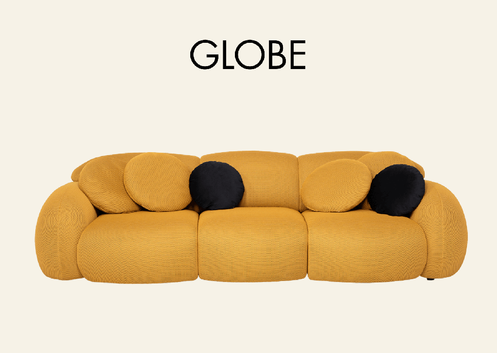 gelbe Couch in wolkenform und Aufschrift "Globe"