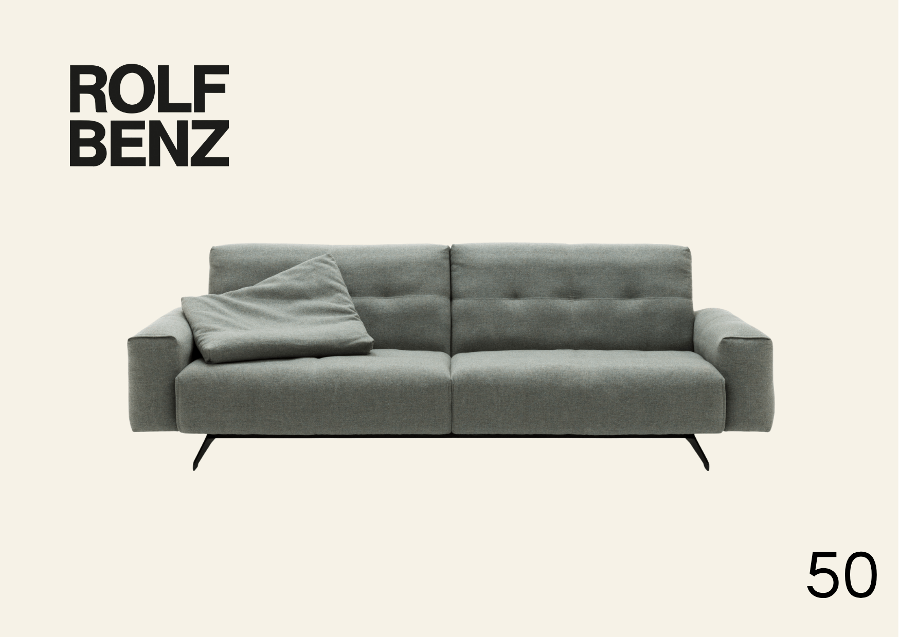 hellgrüne Polsterbank mit eingezogenen Nähten. Aufschrift Bild: Rolf Benz 50.