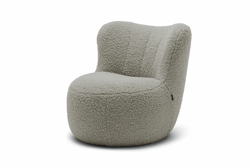 grauer designersessel im plüschbezug vor weißem hintergrund freistil rolf benz 173